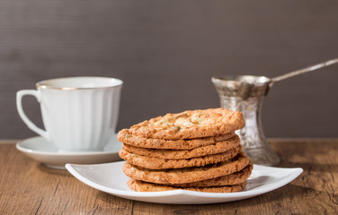 Cup of coffee with tasty  cookies and turk for coffee