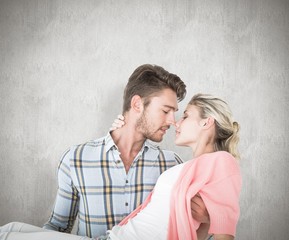 Handsome man picking up and hugging his girlfriend