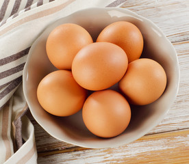 Fresh raw   brown eggs in  bowl