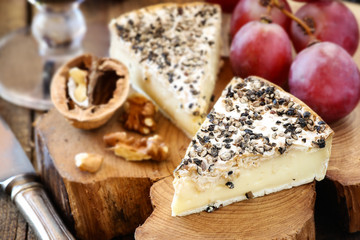 White mold cheese like Brie or Camambert with black papper