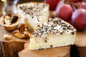 White mold cheese like Brie or Camembert with black papper
