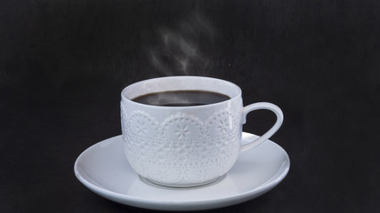 Lace cup of coffee with steam