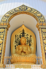 Golden Buddha statue at World Peace Pagoda in Pokhara, Nepal.