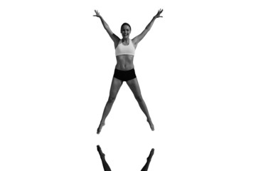 Composite image of fit woman jumping with arms out