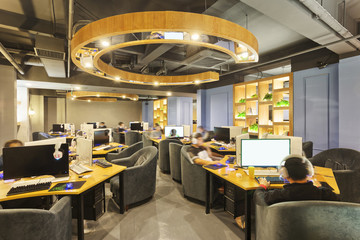 people playing games in internet cafe