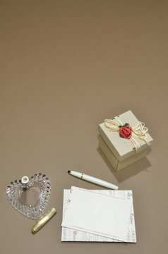 Writing a letter, a box and a brown background