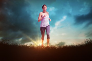 Composite image of focused fit blonde jogging