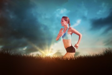 Fototapeta na wymiar Composite image of fit woman jogging