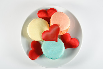 macaroons and hearts on a plate