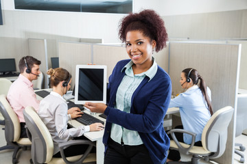 Confident Customer Service Representative Displaying Tablet Comp