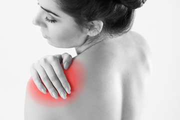 Monochrome Studio Shot Of Woman With Painful Shoulder