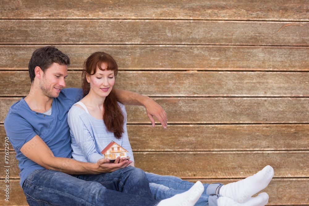 Aufkleber composite image of couple using tablet at home