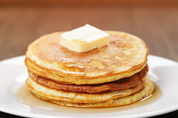 Classic pancakes with butter and syrup