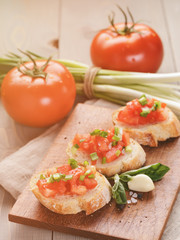 simple italian appetizing bruschetta with tomato and basil, on