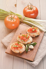 simple italian appetizing bruschetta with tomato and basil, on