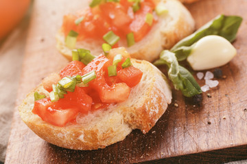 simple italian appetizing bruschetta with tomato and basil, on