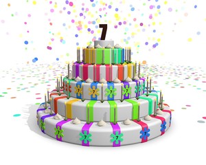 Obraz premium Colorful rainbow cake with on top a chocolate number 7