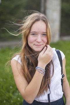 Young cute teen girl portrait outdoors.