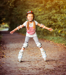 Fototapeta na wymiar little girl on roller skates