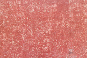 Crack red painted wall texture background.