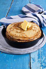 The stack of pancakes with butter