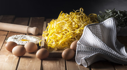 noodles with ingredients on the wooden table