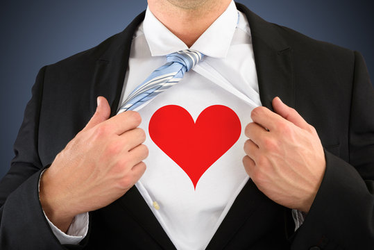 Businessman Pulling His Shirt Showing Heart Shape Symbol
