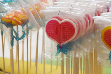 Heart-shaped lollipops in plastic bag