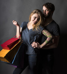 Happy couple with shopping bags