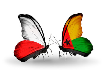 Two butterflies with flags Poland and Guinea Bissau