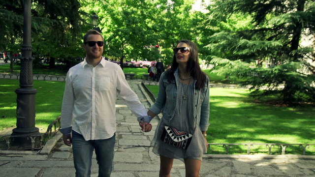 Couple in love walking in beautiful city park