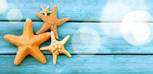 Beach. Starfish on blue wooden deck.
