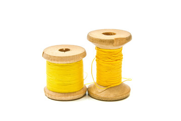 Fototapeta na wymiar spools of yellow thread