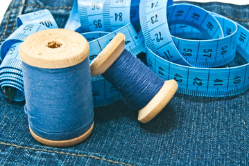 meter and spools of blue thread