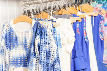 Fashionable blue and white clothes in the shop