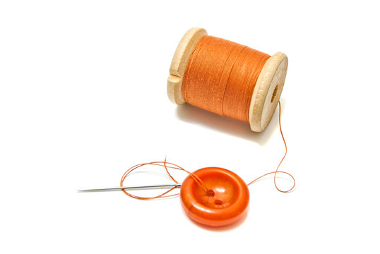 Orange Spool Of Thread, And Button