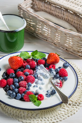 Closeup of berry fruits with cream