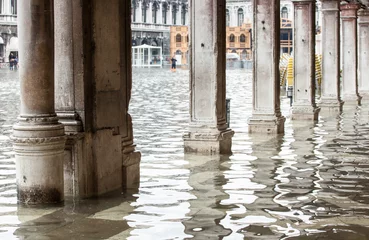 Fototapeten View of the arcades with high water in Venice. © Antonio Gravante