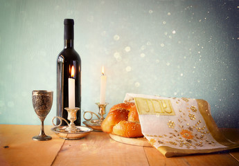 Sabbath image. challah bread and candelas on wooden table