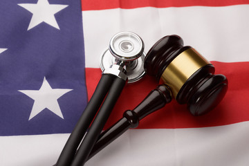 Wooden Gavel And Stethoscope On Usa Flag