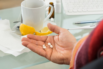 Businessman Holding Pills