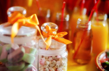 fruit jelly in a glass jar at a party