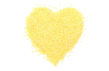 Heart shaped millet groats on white background