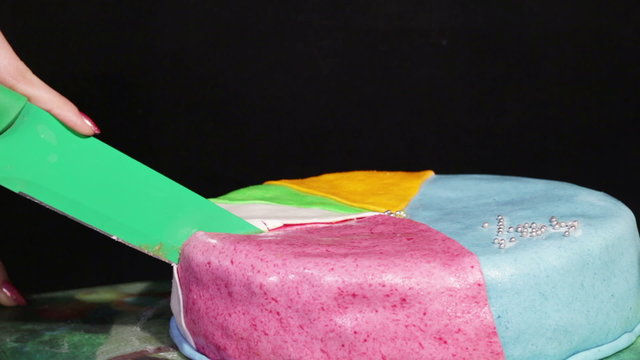 Cuting Multi-colored cake