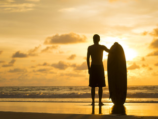 SIlhouette of a Surfer on the beach in Thailand