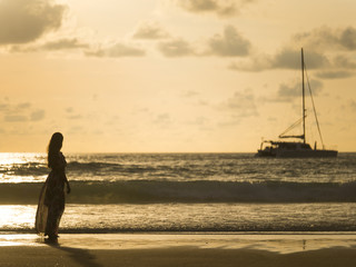  Silhouette of a young woman on the beach in Thailand