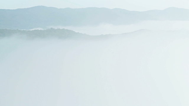 Sunrise Time Lapse with moving fog in Mountain over the valley