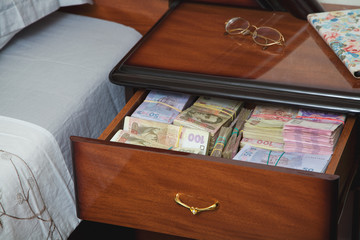 Bundles of banknotes in bedside table