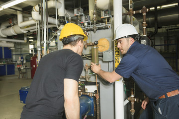repairman engineer or inspector who check the system.