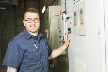 repairman engineer control panel valve equipment in a boiler